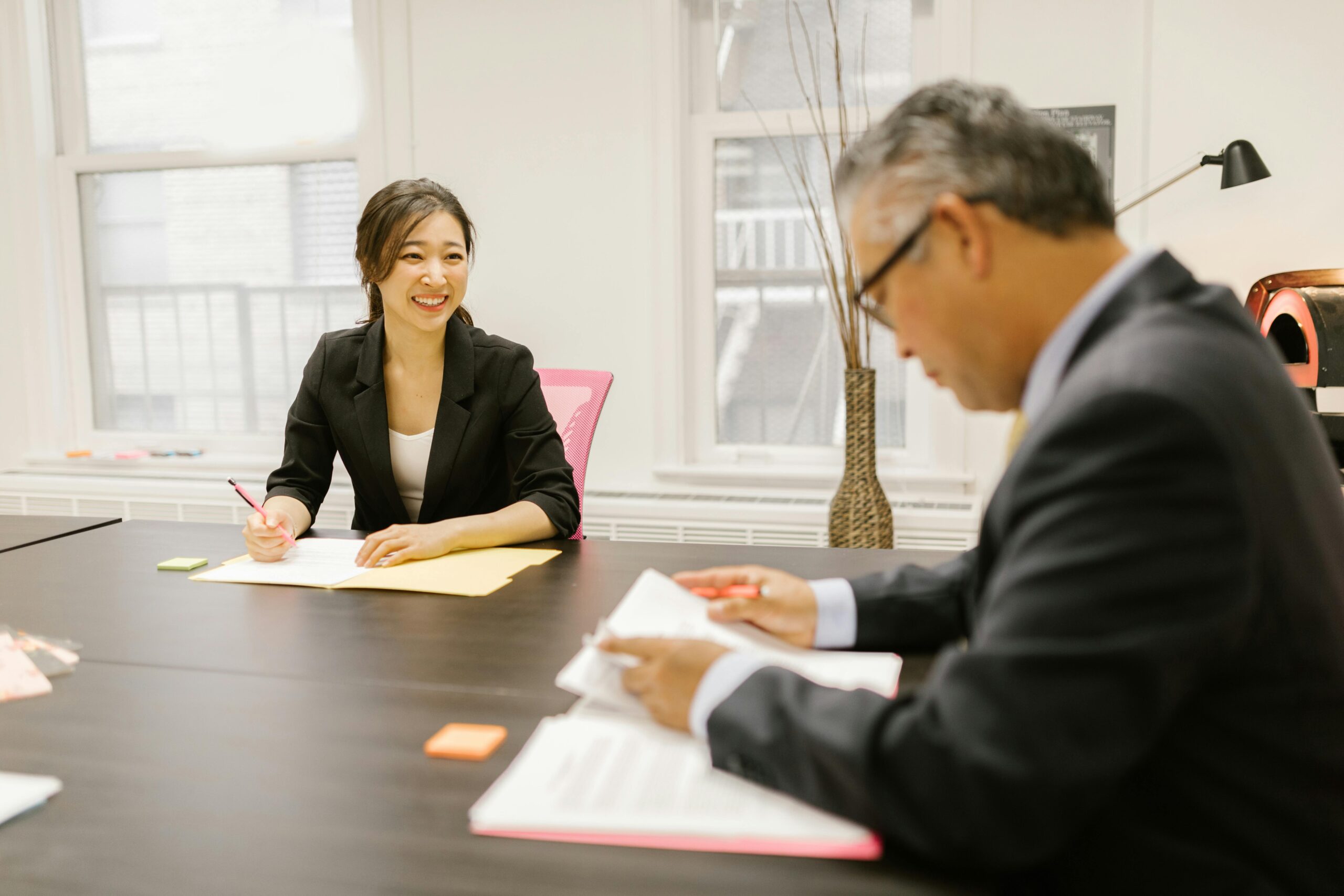 Professional team members having a productive discussion at an office table